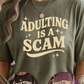 Adulting is a Scam Graphic Tee