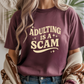 Adulting is a Scam Graphic Tee